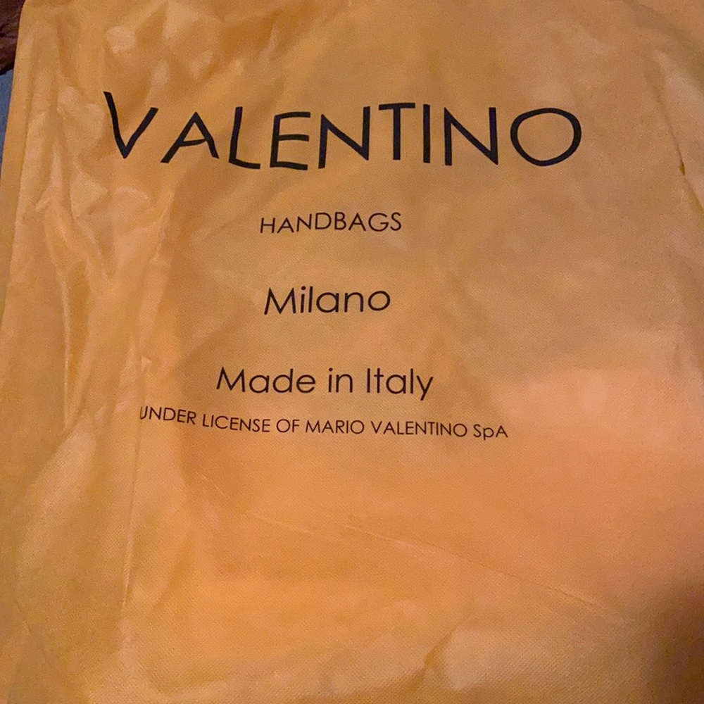 Valentino gold bag, sold off site.